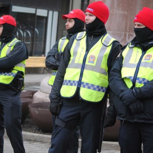 Police observing the event wore red toques and caps to express solidarity.