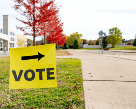 What is the Liberal Party Doing About Climate Change? | A yellow sign directing people to vote