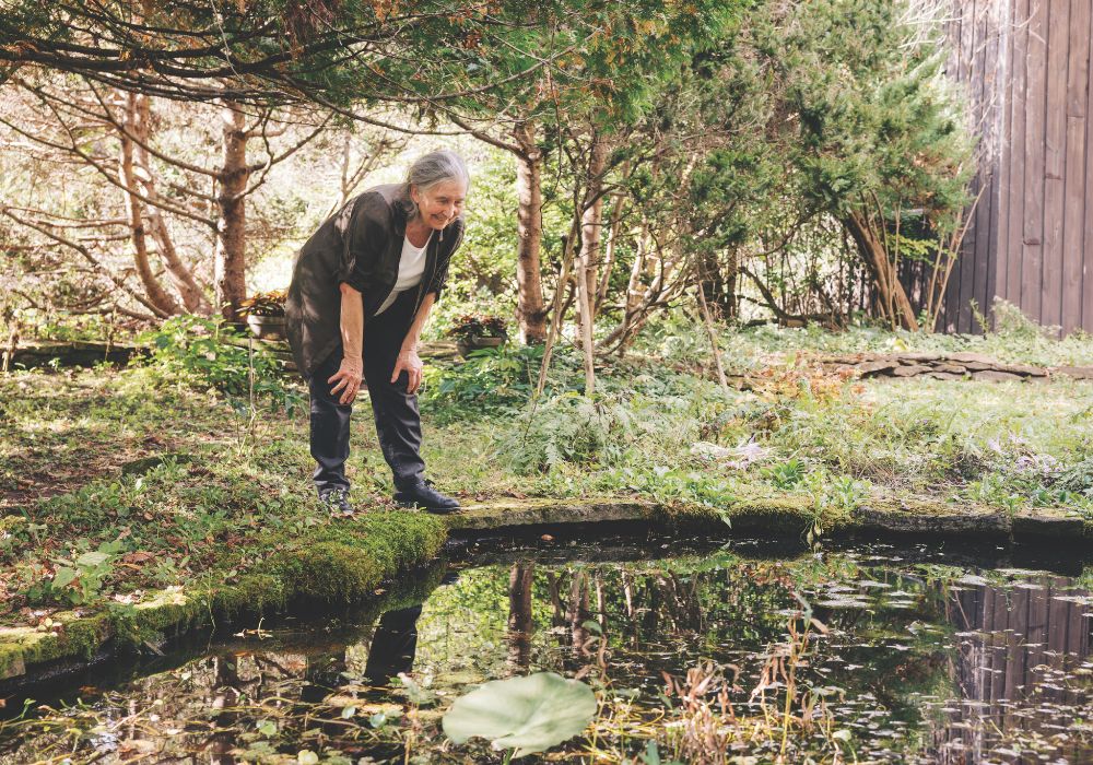 Diana Beresford-Kroeger by her pond outside of Merrickville, Ontario.